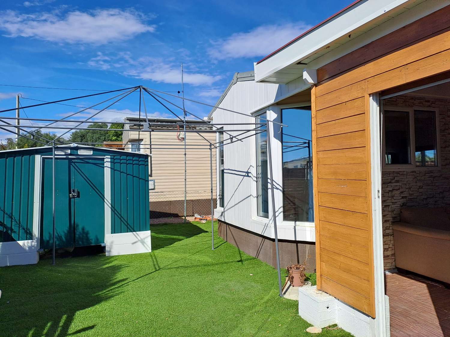 Unique BK Senator mobile home with extension and stoarge sheds