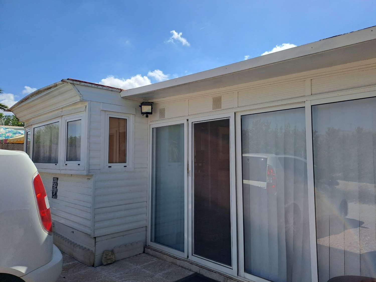 Mobile home with conservatory on private site