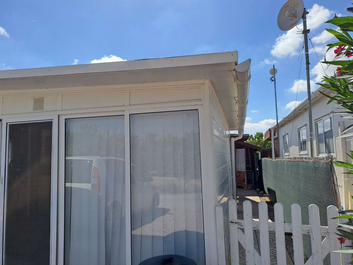 Mobile home with conservatory on private site