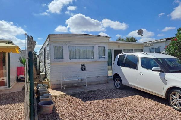 Mobile home with conservatory on private site